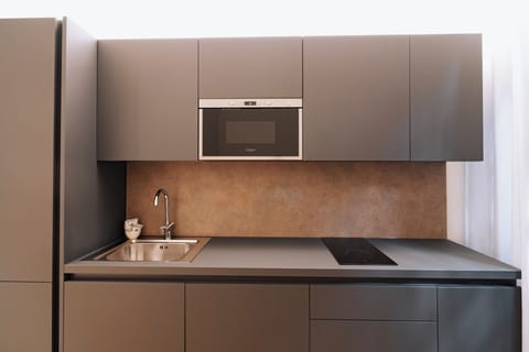 Standard Apartment | Living area | 32-inch flat-screen TV with satellite channels