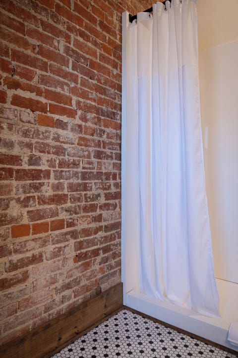 Comfort Room, 1 King Bed with Sofa bed, City View | Bathroom | Hair dryer, towels, soap, shampoo