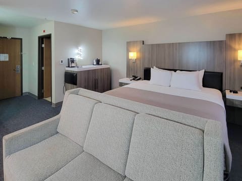 Premium bedding, desk, laptop workspace, blackout drapes