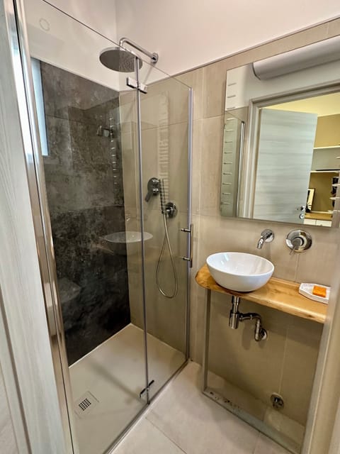 Single Room, Courtyard View | Bathroom | Shower, rainfall showerhead, hair dryer, towels