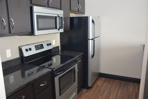 Luxury Suite, 1 Bedroom | Private kitchen | Fridge, microwave, coffee/tea maker