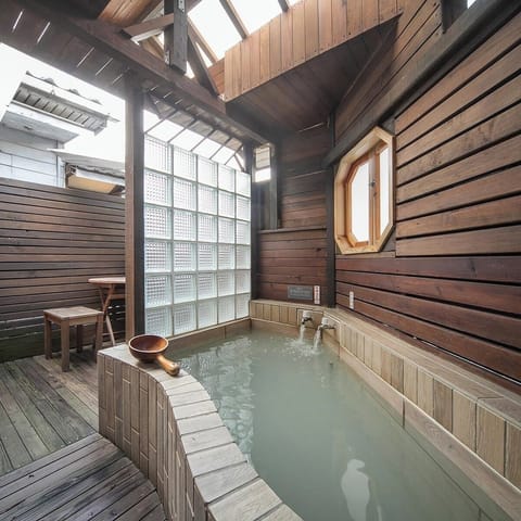 Deluxe Room, 1 Double Bed (Partial open-air hot spring bath) | Bathroom | Combined shower/tub, spring water tub, hair dryer, slippers