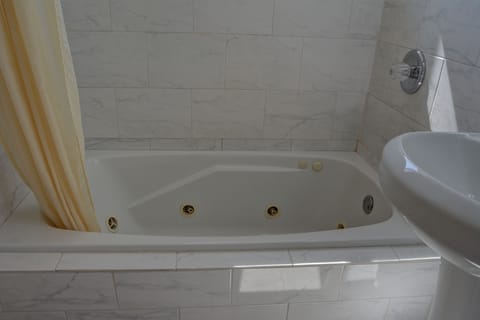 Superior Room, 1 King Bed | Bathroom | Separate tub and shower, towels, soap, shampoo