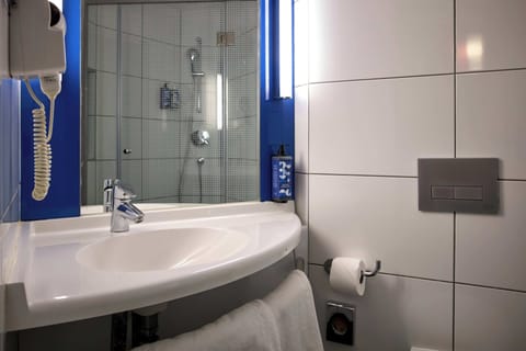 Shower, eco-friendly toiletries, hair dryer, slippers