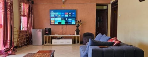 Family Bungalow, Garden View | Living area | 32-inch Smart TV with digital channels, DVD player