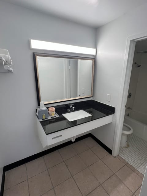 Combined shower/tub, towels, soap, shampoo