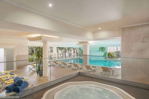 Indoor pool, outdoor pool, pool umbrellas, sun loungers