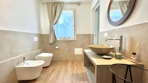 Deluxe Quadruple Room, Patio, Garden View | Bathroom | Shower, hair dryer, towels, soap