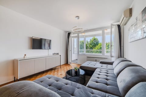 Family Apartment, 1 Bedroom, Balcony (The Green Corner Apartment With) | Living area | Smart TV