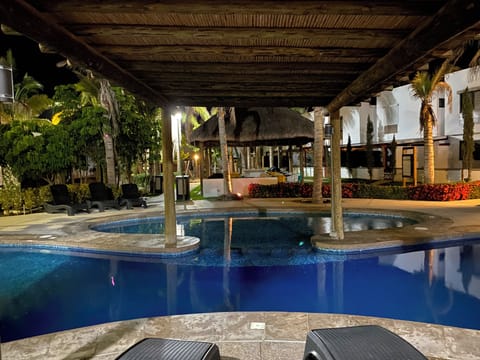 Outdoor pool, open 9:00 AM to 10:00 PM, pool umbrellas, sun loungers