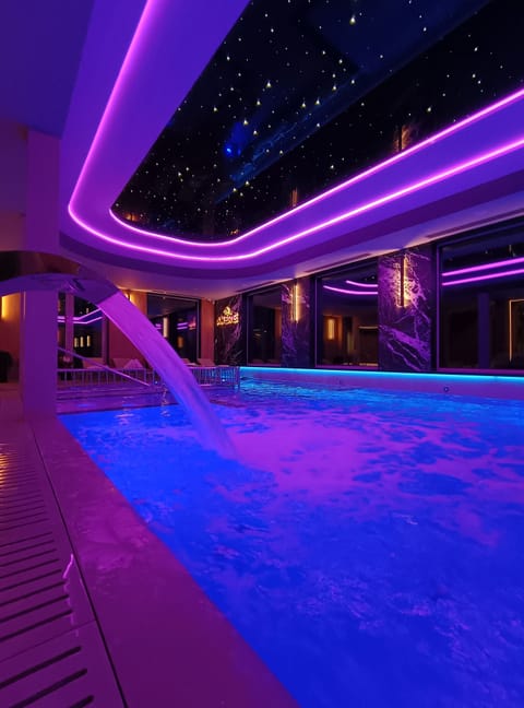 Indoor pool, open noon to 8:00 PM, sun loungers, lifeguards on site