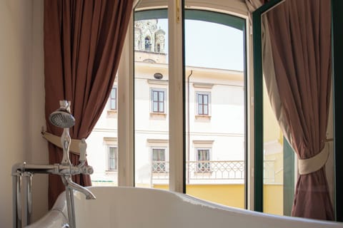 Luxury Room, City View | Bathroom | Separate tub and shower, free toiletries, hair dryer, slippers