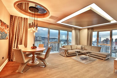 King Suite | Living area | 60-inch LCD TV with satellite channels, TV