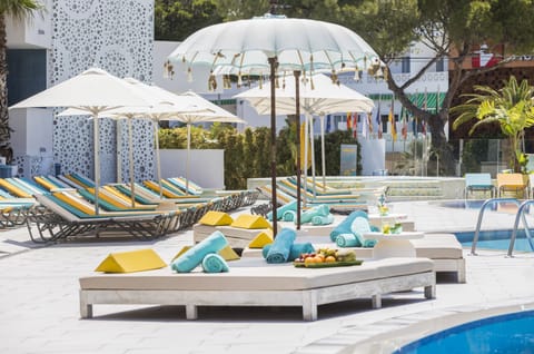 Seasonal outdoor pool, open 10:00 AM to 8:00 PM, pool umbrellas