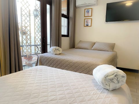 Family Room, Balcony | Blackout drapes, free WiFi, bed sheets