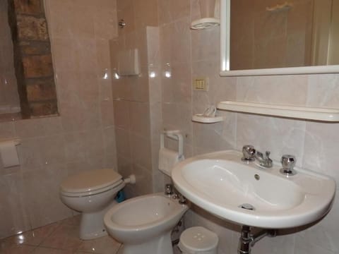 Shower, towels, soap, toilet paper