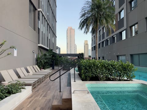 Outdoor pool, open 7:00 AM to 10:00 PM, pool umbrellas, sun loungers