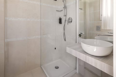 Shower, free toiletries, slippers, bidet