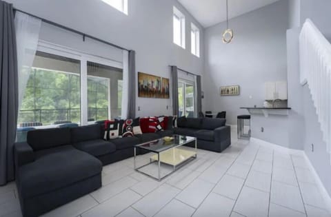 House | Living area | 75-inch Smart TV with digital channels, foosball, streaming services
