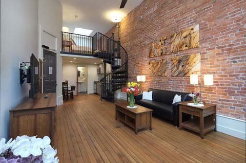 Lofted Studio (2nd and 3rd Floors) | Living area | TV