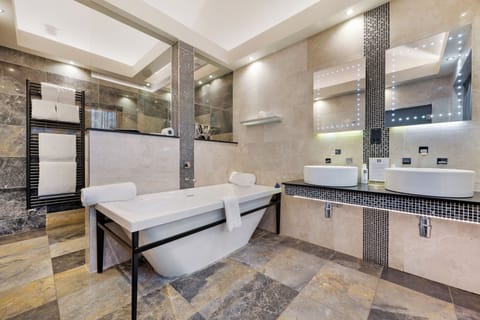 Designer toiletries, hair dryer, towels, soap