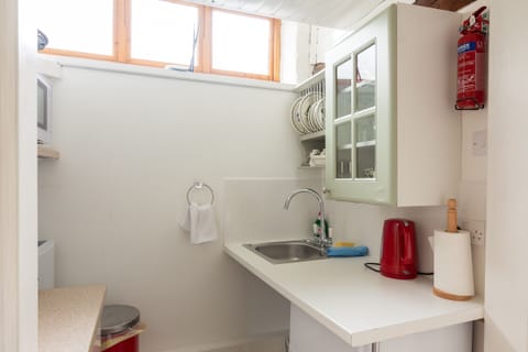 Superior Cottage, 1 King Bed, Kitchenette | Private kitchen | Shared fridge, microwave, coffee/tea maker, electric kettle