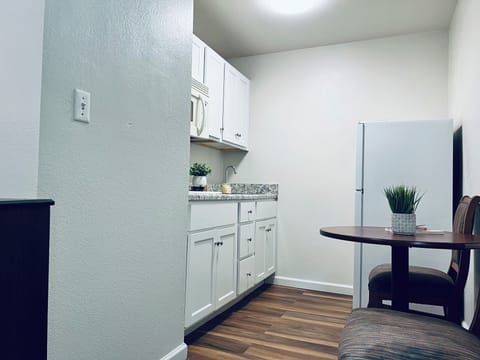 Mini-fridge, microwave, stovetop, cookware/dishes/utensils