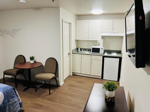 Mini-fridge, microwave, stovetop, cookware/dishes/utensils