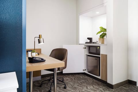 Desk, blackout drapes, iron/ironing board, free cribs/infant beds