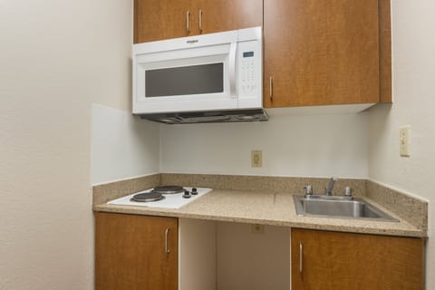 Fridge, microwave, stovetop, dining tables