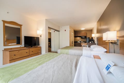 Premium bedding, desk, laptop workspace, iron/ironing board