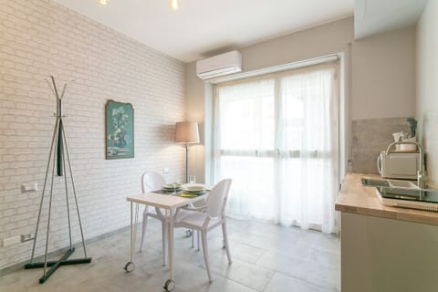 Apartment, 2 Bedrooms, Balcony | Private kitchen | Electric kettle, dining tables