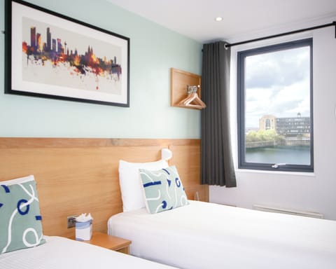 Desk, laptop workspace, blackout drapes, iron/ironing board