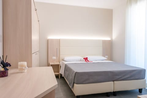 Family Quadruple Room, Balcony | In-room safe, blackout drapes, free WiFi