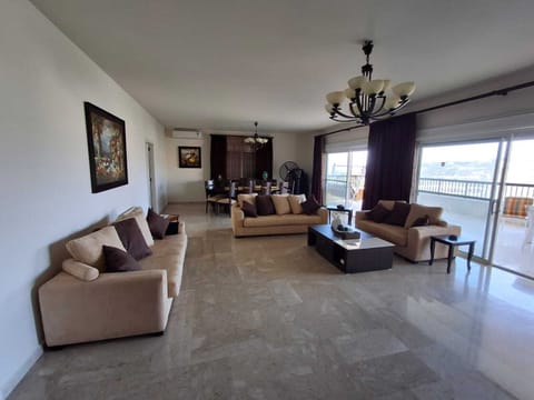 Family Apartment, Sea View | Living room | 50-inch Smart TV with cable channels, Netflix, pay movies