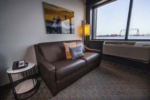 Premium bedding, desk, laptop workspace, iron/ironing board