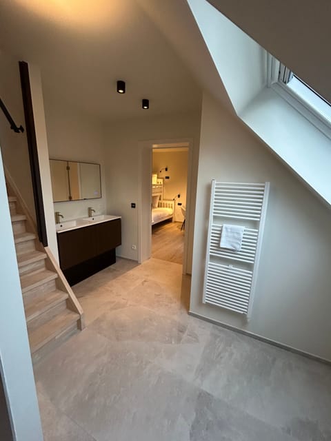 Family Room, 2 Bedrooms, Balcony | Bathroom | Shower, rainfall showerhead, hair dryer, heated floors