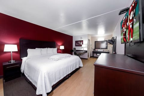 Premium Room, 1 King Bed (Upgraded Bedding & Snack, Smoke Free) | Desk, laptop workspace, blackout drapes, iron/ironing board