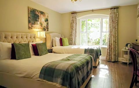 Classic Triple Room, Patio | In-room safe, individually decorated, individually furnished