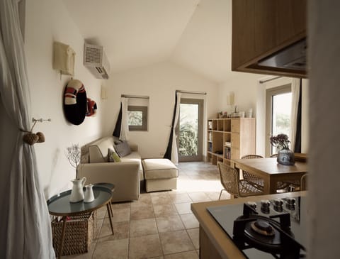 Deluxe House, Patio, Bay View | Living area | 40-inch flat-screen TV with digital channels