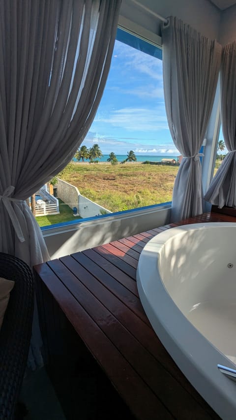 Deluxe Suite, 2 Bedrooms, Balcony, Sea View | Private spa tub