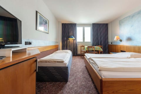 Family Triple Room, City View | Blackout drapes, soundproofing, iron/ironing board, WiFi