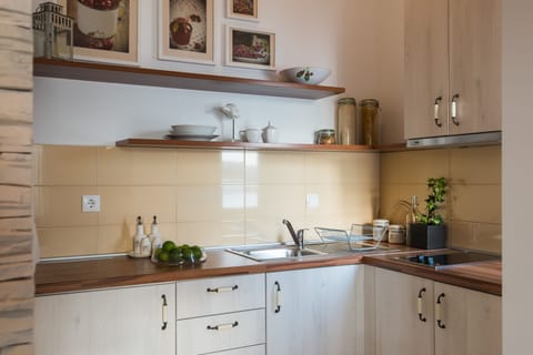 Design Apartment, 1 Bedroom, Sea View (Top Floor) | Private kitchen | Full-size fridge, microwave, coffee/tea maker, electric kettle