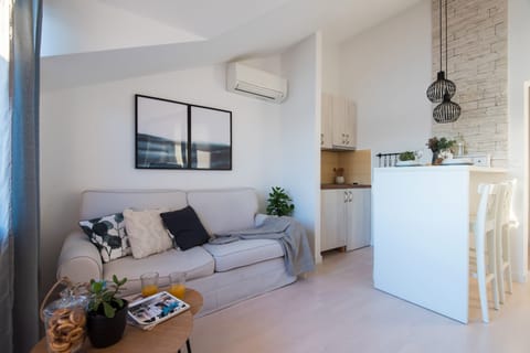 Design Apartment, 1 Bedroom, Sea View (Top Floor) | Living area | Flat-screen TV