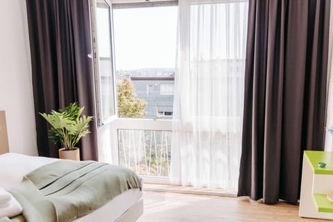 Premium bedding, desk, laptop workspace, free WiFi