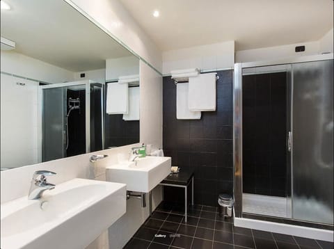 Suite, Lake View | Bathroom | Shower, hair dryer, slippers, towels