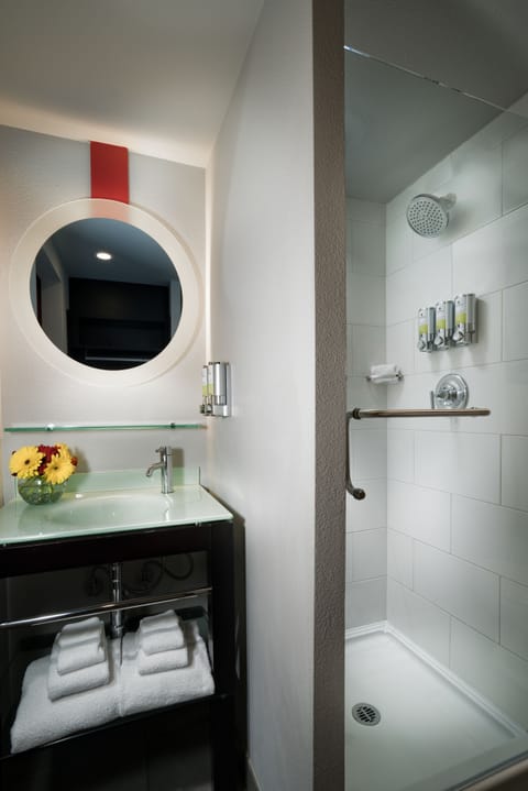 Designer toiletries, hair dryer, bathrobes, towels