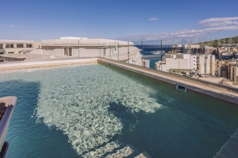 Indoor pool, outdoor pool, pool umbrellas, sun loungers