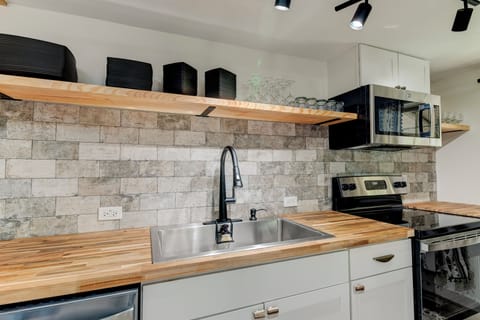 Deluxe Apartment, Non Smoking, Courtyard View | Private kitchen | Microwave, coffee/tea maker, cleaning supplies, kitchen islands