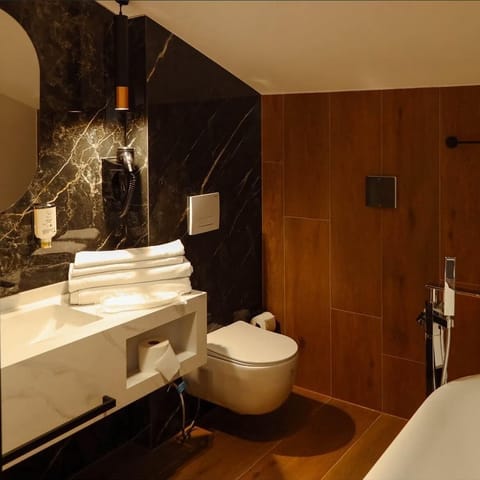 Deluxe Suite, Balcony | Desk, laptop workspace, blackout drapes, iron/ironing board